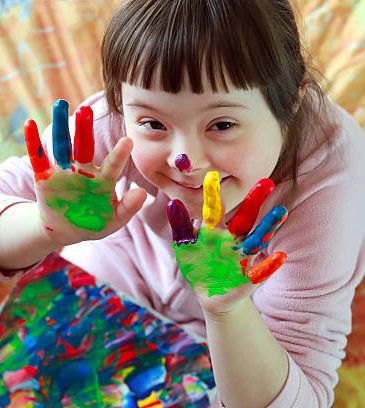 Cute little girl with painted hands Cropped